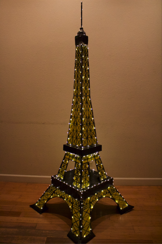 An Eiffel Tower made with cardboard.